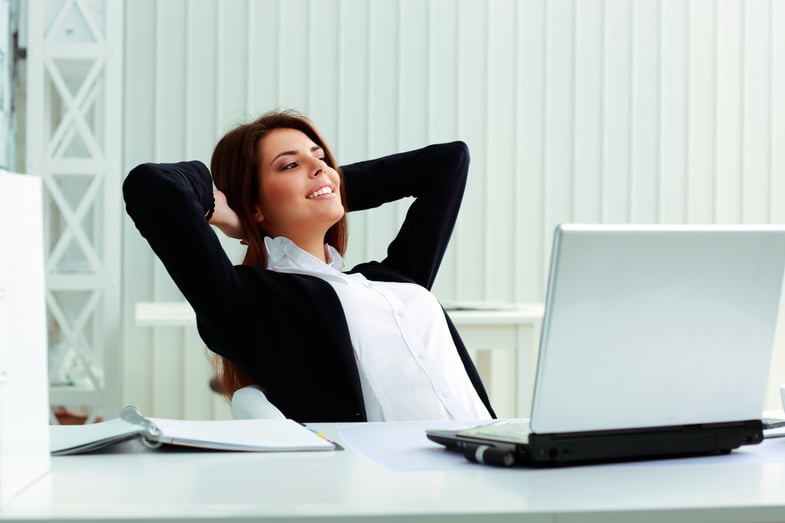 Young happy businesswoman resting in office